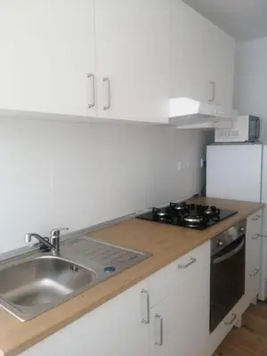 a white kitchen with a sink and a stove at 3 bedroom Apartment in San Fernando in San Fernando
