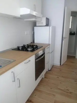 a kitchen with a stove and a refrigerator at 3 bedroom Apartment in San Fernando in San Fernando