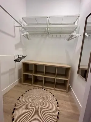 a room with a rug and a table and shelves at VILLA MARIAH Barrosa Playa in Novo Sancti Petri