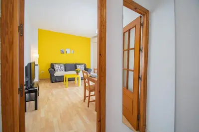 a view of a living room with a couch and a table at El Rosal de Huertas in Cádiz