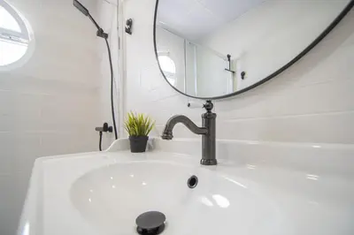 a bathroom with a sink and a mirror at El Rosal de Huertas in Cádiz
