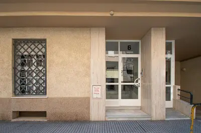 an entrance to a building with a glass door at El Rosal de Huertas in Cádiz
