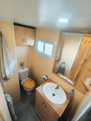 a small bathroom with a sink and a toilet at Casa en Chiclana de la Frontera, Playa La Barrosa in Chiclana de la Frontera