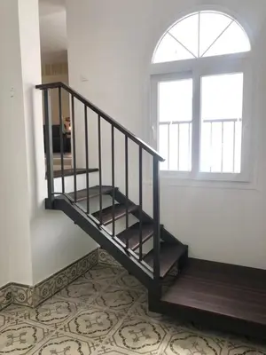 a staircase in a room with a window at Apartamento en Plaza Plateros in Jerez de la Frontera