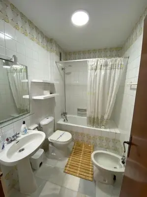 a bathroom with a sink and a toilet and a shower at Apartamento Acuario in Sanlúcar de Barrameda