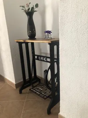 a table with a vase on top of it at Casa Campiña Jerezana in Torrecera