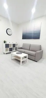 a living room with a couch and a coffee table at Apartamento Plaza Calzada 1 in Sanlúcar de Barrameda