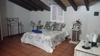 a bedroom with a bed in a room at El Amanecer in El Puerto de Santa María