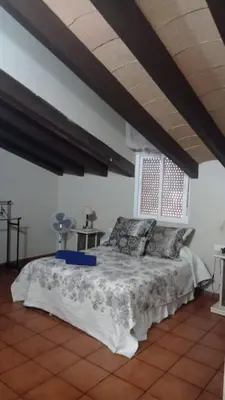 a bedroom with a bed with blue towels on it at El Amanecer in El Puerto de Santa María