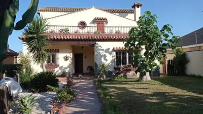 a white house with a balcony on top of it at El Amanecer in El Puerto de Santa María