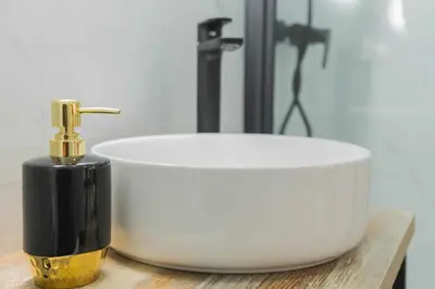 a black and white sink with a faucet in a bathroom at Jacuzzi Amanecer de Plata Decoración Romántica in Chiclana de la Frontera
