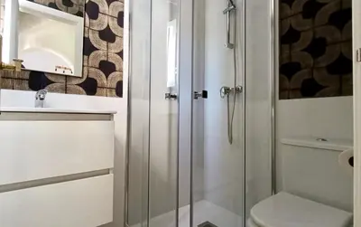 a bathroom with a shower and a toilet at Las Américas by RentCadiz in El Puerto de Santa María