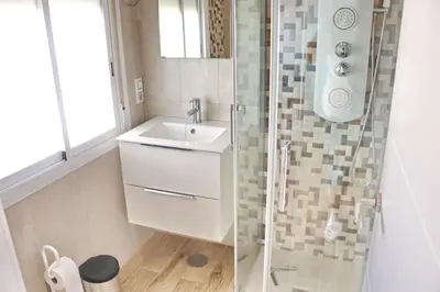 a bathroom with a sink and a shower at Chalet Cielo Azul in Conil de la Frontera