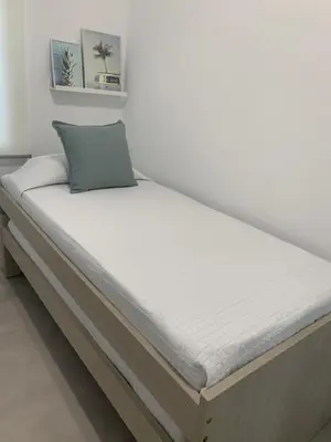 a bed in a room with a mattress at Apartamento Al Andalus. La Barrosa. in Chiclana de la Frontera