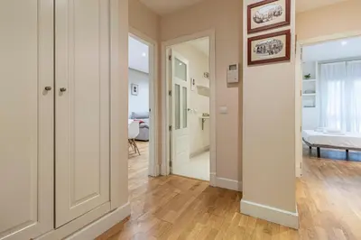 a hallway with a door leading to a bedroom at Allo Apartments Santo Domingo Parking 2 Habitaciones in Jerez de la Frontera