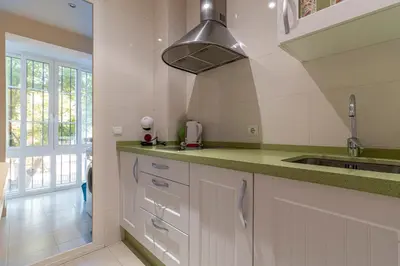a kitchen with white cabinets and a sink at Allo Apartments Santo Domingo Parking 2 Habitaciones in Jerez de la Frontera