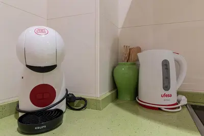 a coffee maker and a toaster on a kitchen counter at Allo Apartments Santo Domingo Parking 2 Habitaciones in Jerez de la Frontera