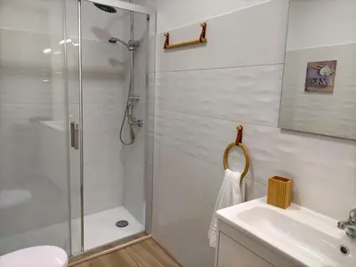 a bathroom with a shower and a sink at Apartamento Lola Home in Sanlúcar de Barrameda