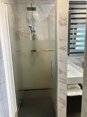 a shower with a glass door in a bathroom at LOFT VILLALUCIA in Conil de la Frontera