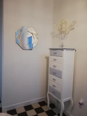 a room with a dresser and a mirror on the wall at Apartamento Arco´s House in Sanlúcar de Barrameda