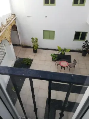 an overhead view of a patio with chairs and a table at Apartamento Arco´s House in Sanlúcar de Barrameda