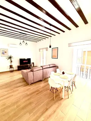 a living room with a couch and a table at Tía Norica - Centro Cádiz in Cádiz