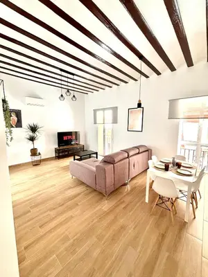 a living room with a couch and a table at Tía Norica - Centro Cádiz in Cádiz