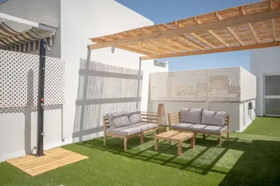 a rendering of a patio with two chairs and a table at Apartamento con terraza privada en el centro del Puerto de Santa María in El Puerto de Santa María