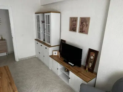 a living room with a flat screen tv on a wall at Apartamento Sotest in Jerez de la Frontera