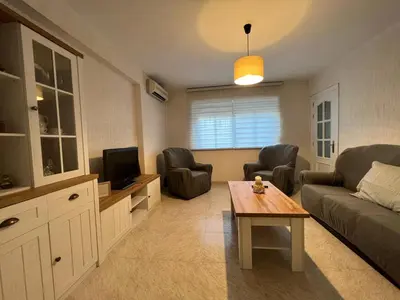 a living room with a couch and a table at Apartamento Sotest in Jerez de la Frontera
