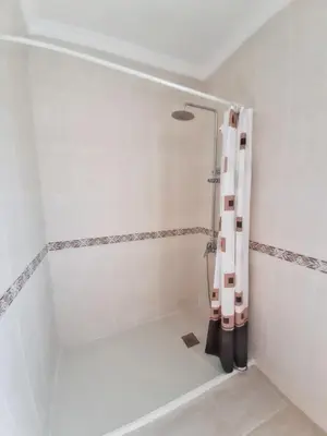 a bathroom with a shower with a shower curtain at Charming villa in Chiclana de la Frontera with private pool in Chiclana de la Frontera