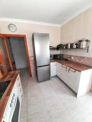 a kitchen with a stainless steel refrigerator at Charming villa in Chiclana de la Frontera with private pool in Chiclana de la Frontera