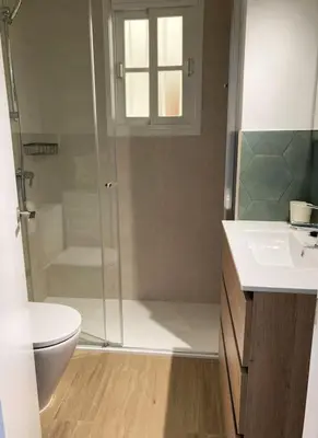 a bathroom with a shower and a toilet and a sink at Enjoy the historic center of Chiclana By C. Dreams in Chiclana de la Frontera