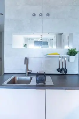 a kitchen with a sink and a counter top at El Beduino by Gades Gestión in Cádiz