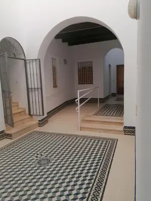a room with a black and white tile floor at Apartamento Pale Cream in Jerez de la Frontera