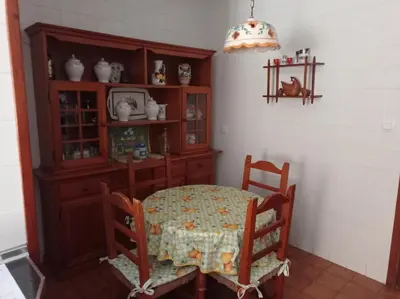 a bedroom with a bed and a window and a mirror at Cruces, piso en pleno centro urbano in Sanlúcar de Barrameda