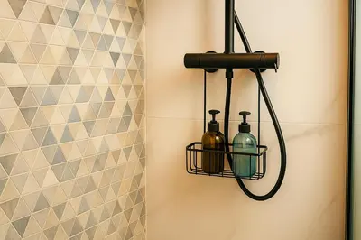 a bathroom with a bottle holder on the wall at Skyline - Beach apartment with breathtaking views and more in Cádiz