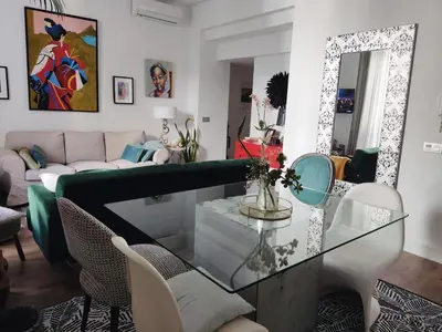 a living room with a glass table and a couch at Porvenir centro in Jerez de la Frontera