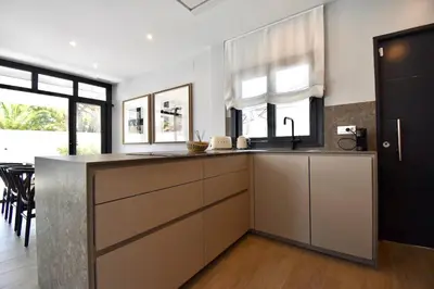a kitchen with a sink and a counter top at Villa Cactae in Novo Sancti Petri