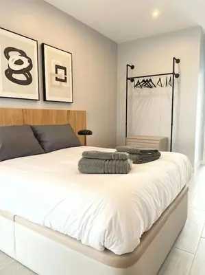 a bedroom with a large white bed in a room at Villa Cactae in Novo Sancti Petri