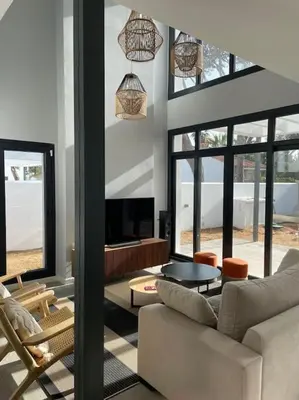 a living room with a couch and a table at Villa Cactae in Novo Sancti Petri