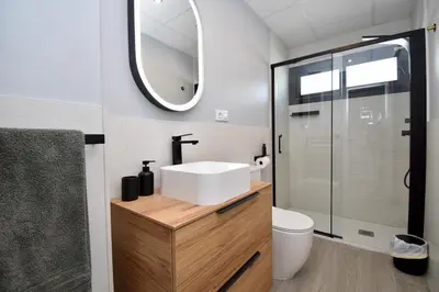 a bathroom with a sink and a mirror at Villa Cactae in Novo Sancti Petri