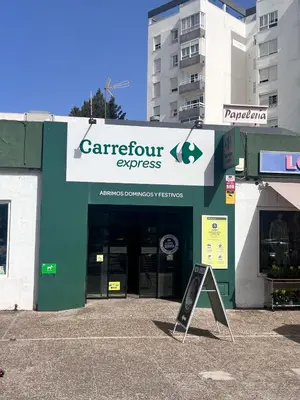 a store front with a sign in front of it at Apartamento en primera línea de playa Valdemar 1 in El Puerto de Santa María