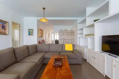 a living room with a couch and a table at Cielo gaditano in Cádiz