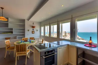 a kitchen with a view of the ocean at Cielo gaditano in Cádiz