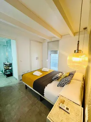 a bedroom with a large bed in a room at La Botica Grupo AC Gestion in Cádiz