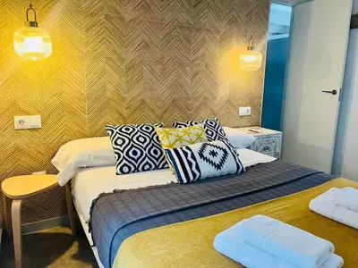 a bedroom with a bed with pillows on it at La Botica Grupo AC Gestion in Cádiz