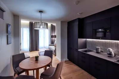 a kitchen and dining room with a table and chairs at VILLAR Suites by Cadiz4Rentals in Cádiz