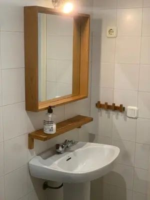 a bathroom with a sink and a mirror at Casa Murillo in El Puerto de Santa María