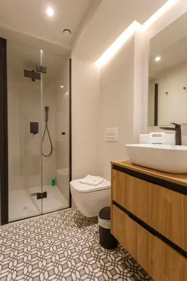 a bathroom with a sink and a toilet and a shower at Casa Manuel de Falla by Cadiz4Rentals in Cádiz